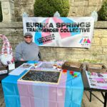 individual tabling at an event for Eureka Springs Transgender Collective