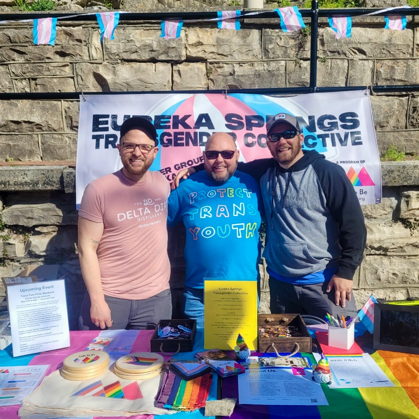 three people tabling at an event